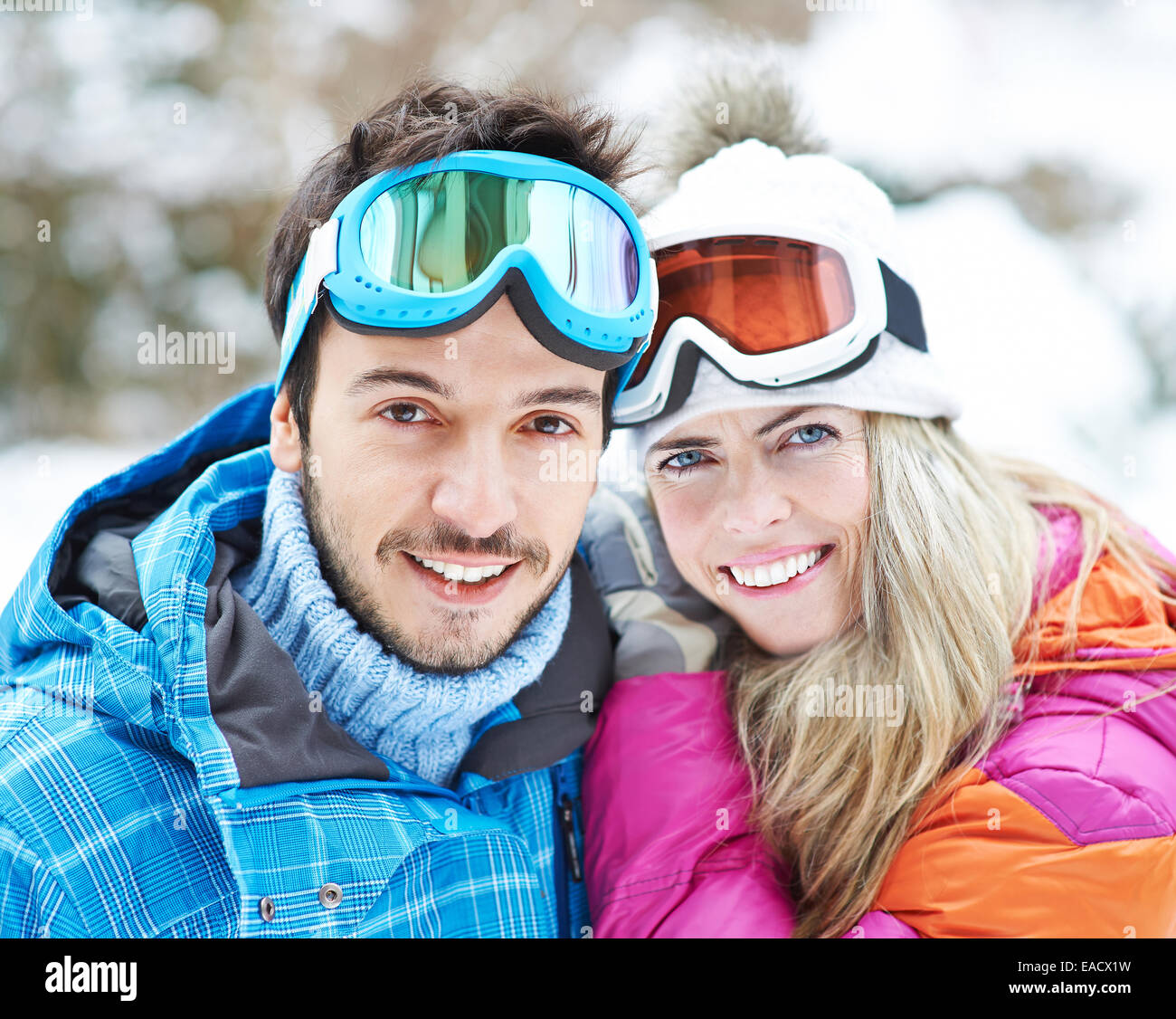 Happy couple together on a ski trip in winter Stock Photo