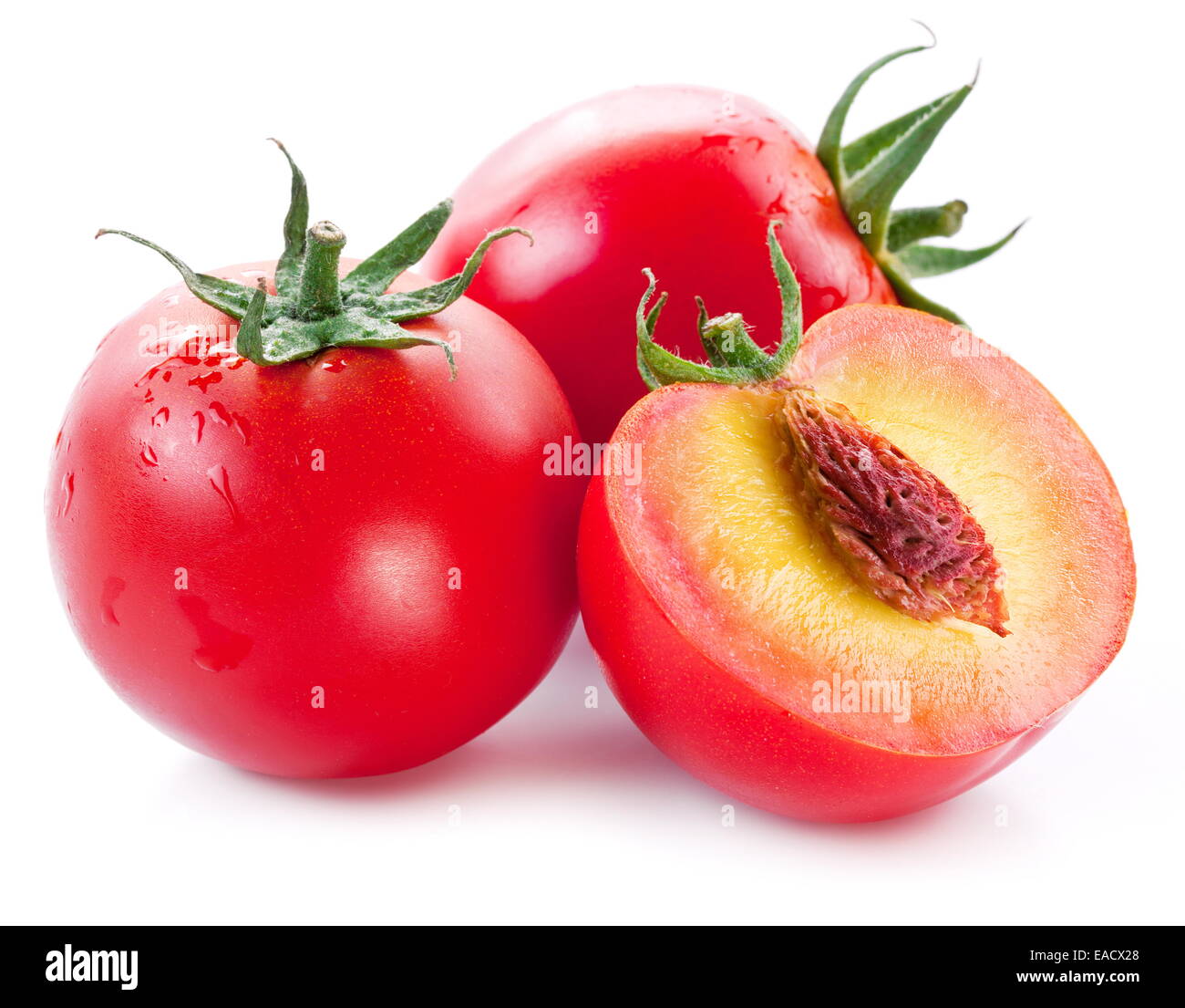 Flesh tomatoes in cut as a ripe peach. Product of genetic engineering. Computer assembly. Stock Photo