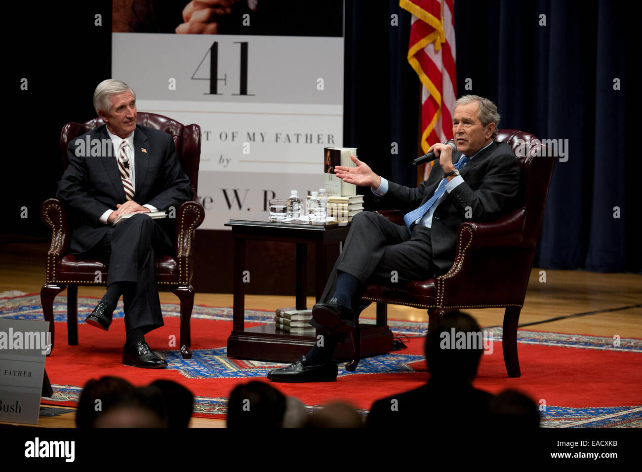 College Station, Texas, USA. 11th November, 2014. Former U.S. President George W. Bush talks about his new book, '41 A Portrait of My Father' wiith former chief of staff Andrew Card during a book event at the Bush Library at Texas A&M University. The elder George H.W. Bush and wife Barbara were in the audience. Credit:  Bob Daemmrich/Alamy Live News Stock Photo