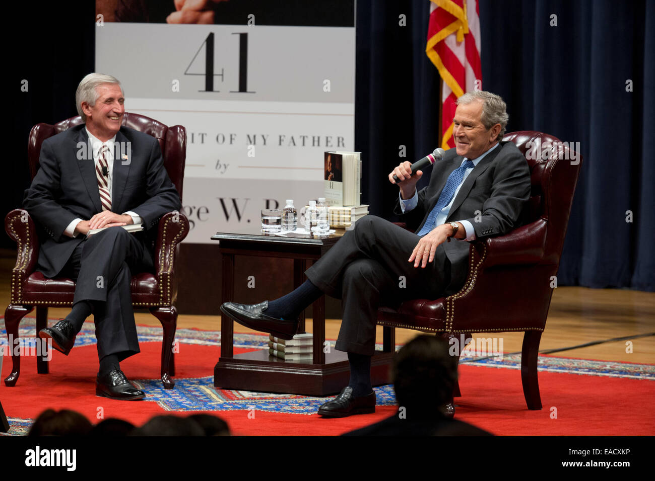 College Station, Texas, USA. 11th November, 2014. Former U.S. President George W. Bush, r,  talks about his new book, '41 A Portrait of My Father' wiith former chief of staff Andrew Card during a book event at the Bush Library at Texas A&M University. The elder George H.W. Bush and wife Barbara were in the audience. Credit:  Bob Daemmrich/Alamy Live News Stock Photo