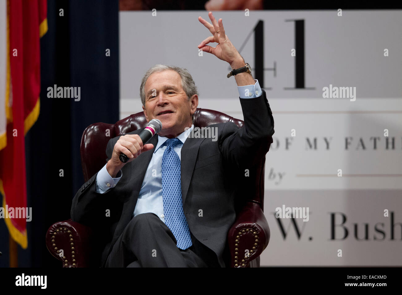 College Station, Texas, USA. 11th November, 2014. Former U.S. President George W. Bush talks about his new book, '41 A Portrait of My Father'  during a book event at the Bush Library at Texas A&M University.  Bush's dad, former President George H.W. Bush and wife Barbara were in the audience. Credit:  Bob Daemmrich/Alamy Live News Stock Photo