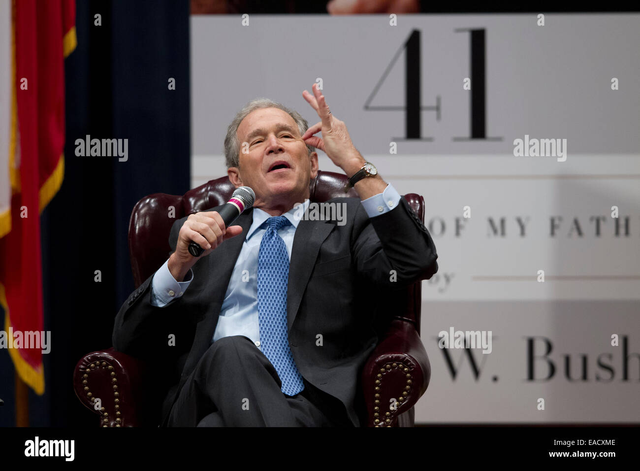 College Station, Texas, USA. 11th November, 2014. Former U.S. President George W. Bush talks about his new book, '41 A Portrait of My Father'  during a book event at the Bush Library at Texas A&M University.  Bush's dad, former President George H.W. Bush and wife Barbara were in the audience. Credit:  Bob Daemmrich/Alamy Live News Stock Photo