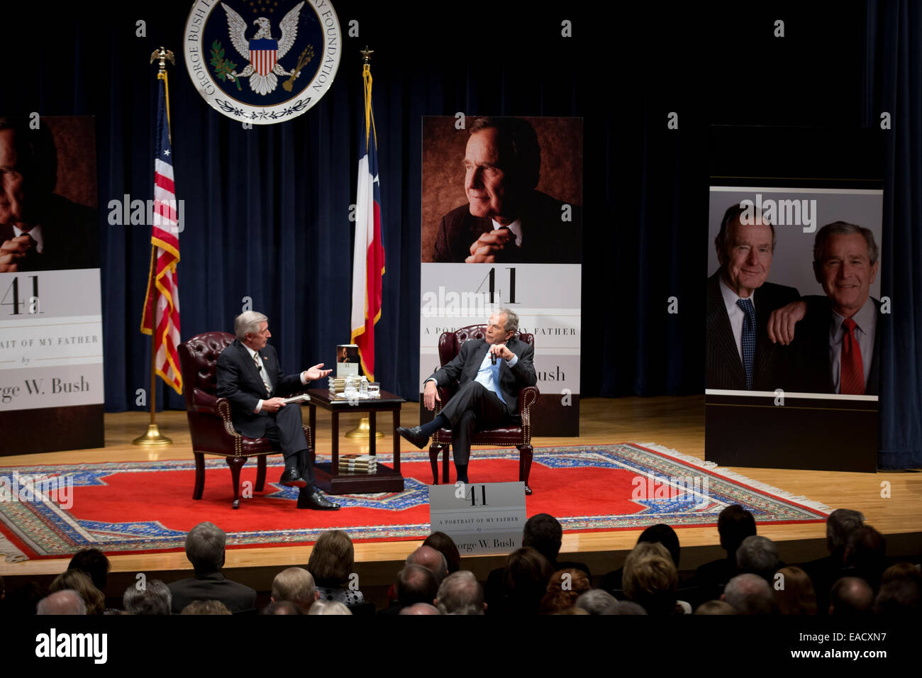 College Station, Texas, USA. 11th November, 2014. Former U.S. President George W. Bush, r, talks about his new book, '41 A Portrait of My Father' wiith former chief of staff Andrew Card during a book event at the Bush Library at Texas A&M University. The elder George H.W. Bush and wife Barbara were in the audience. Credit:  Bob Daemmrich/Alamy Live News Stock Photo