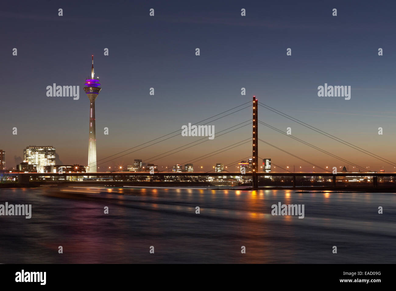 Skyline with Rheinturm tower, 'Stadttor' high-rise building and Rheinkniebrücke bridge at twilight, Düsseldorf Stock Photo