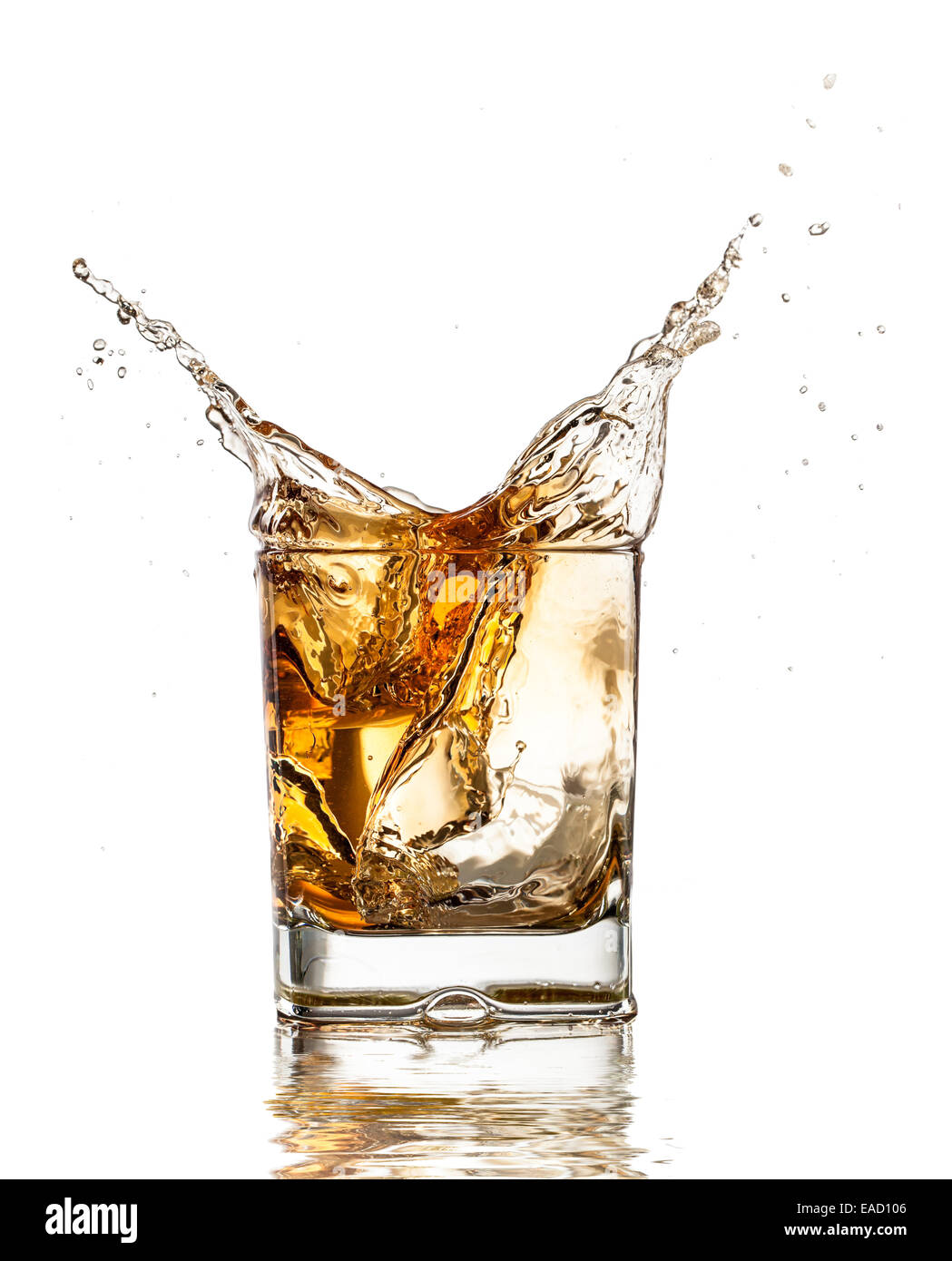 Whiskey glass with splash, isolated on white background Stock Photo