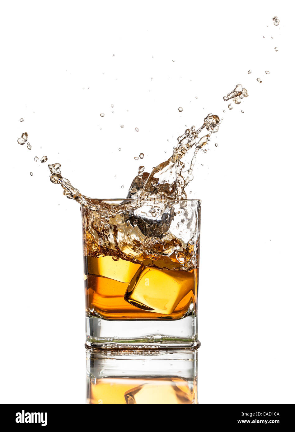 Whiskey glass with splash, isolated on white background Stock Photo