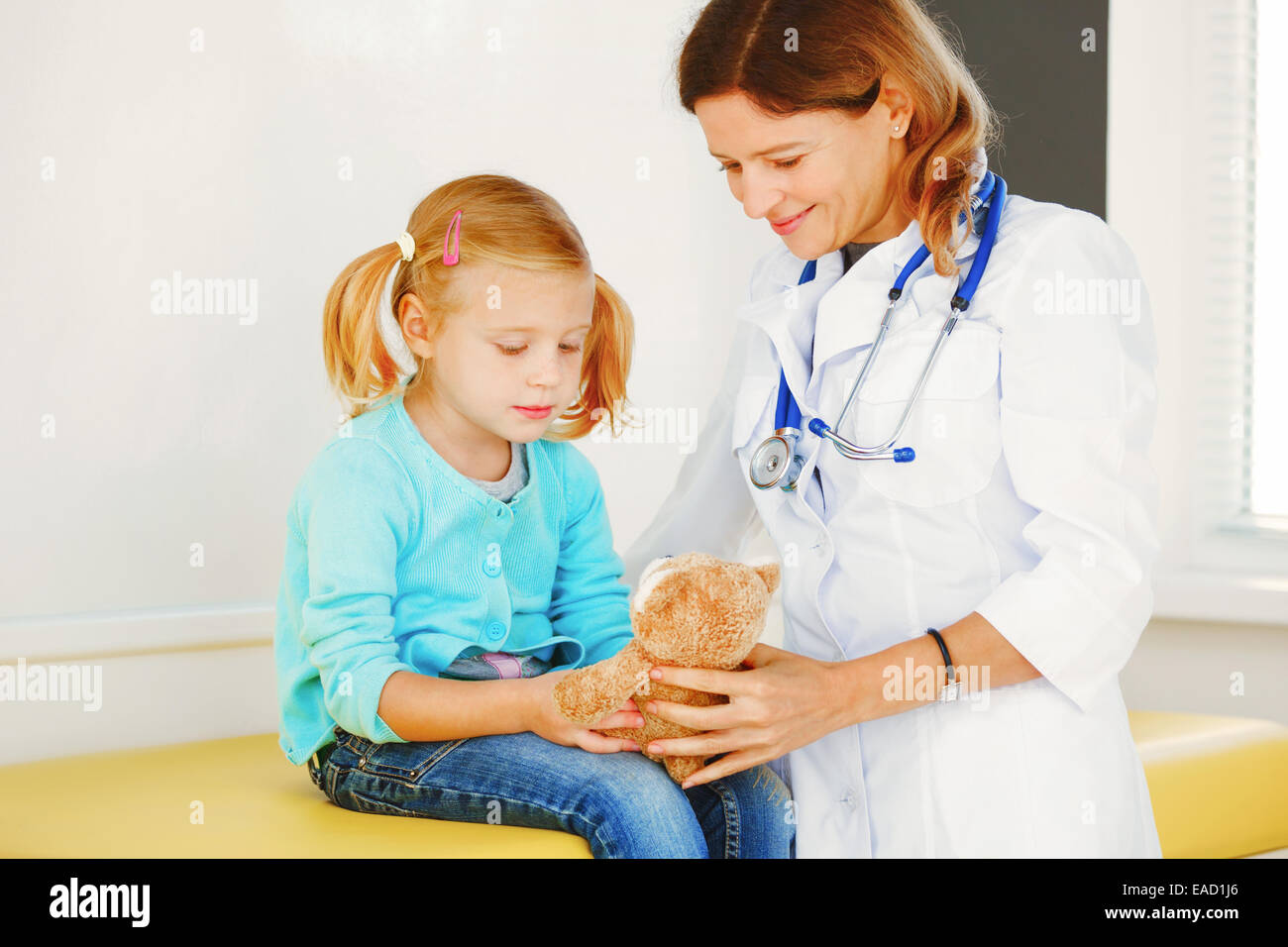 Doctor examining bare chested child with stethoscope Stock Photo - Alamy