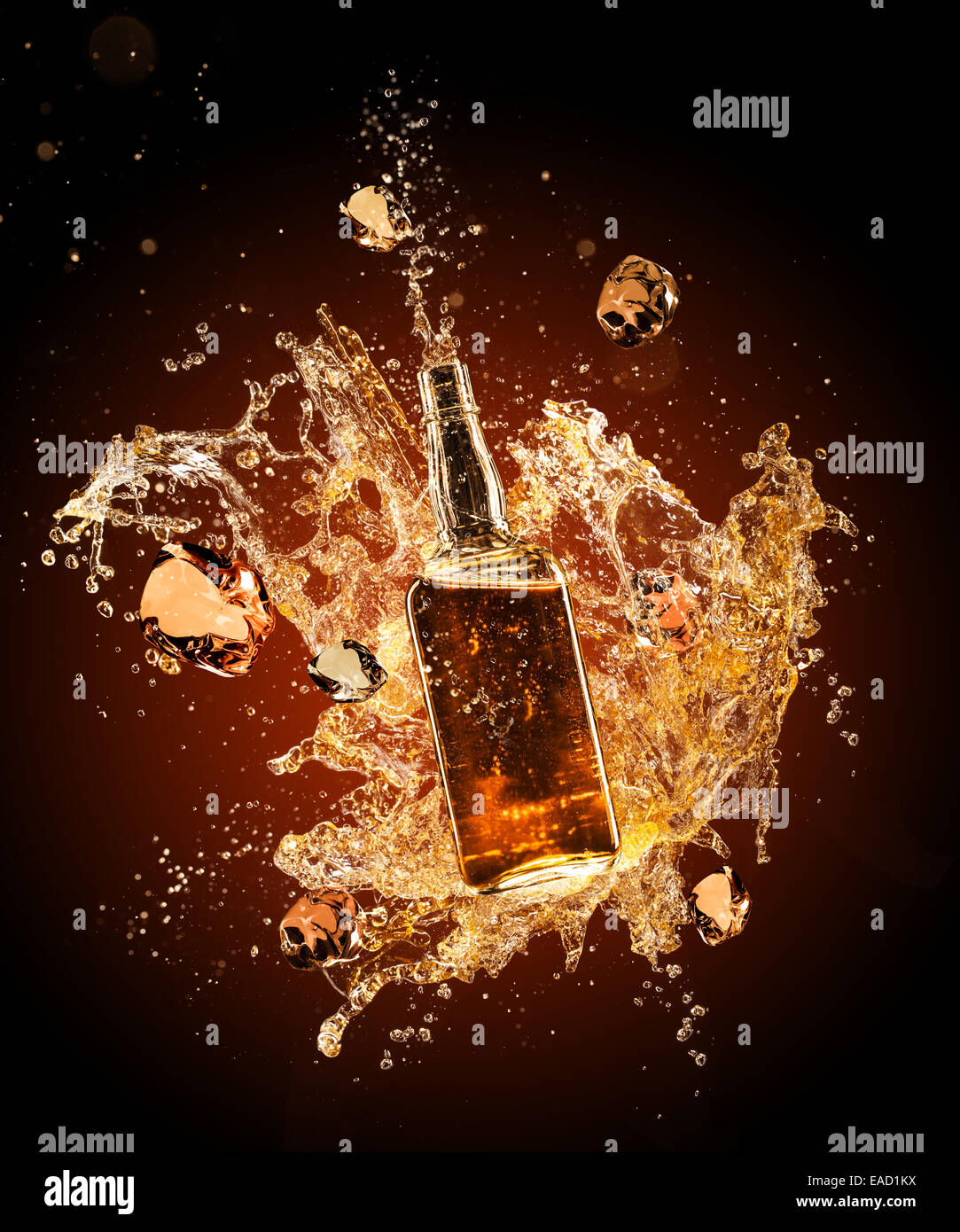 Isolated shot of whiskey splashing around bottler on black background Stock Photo