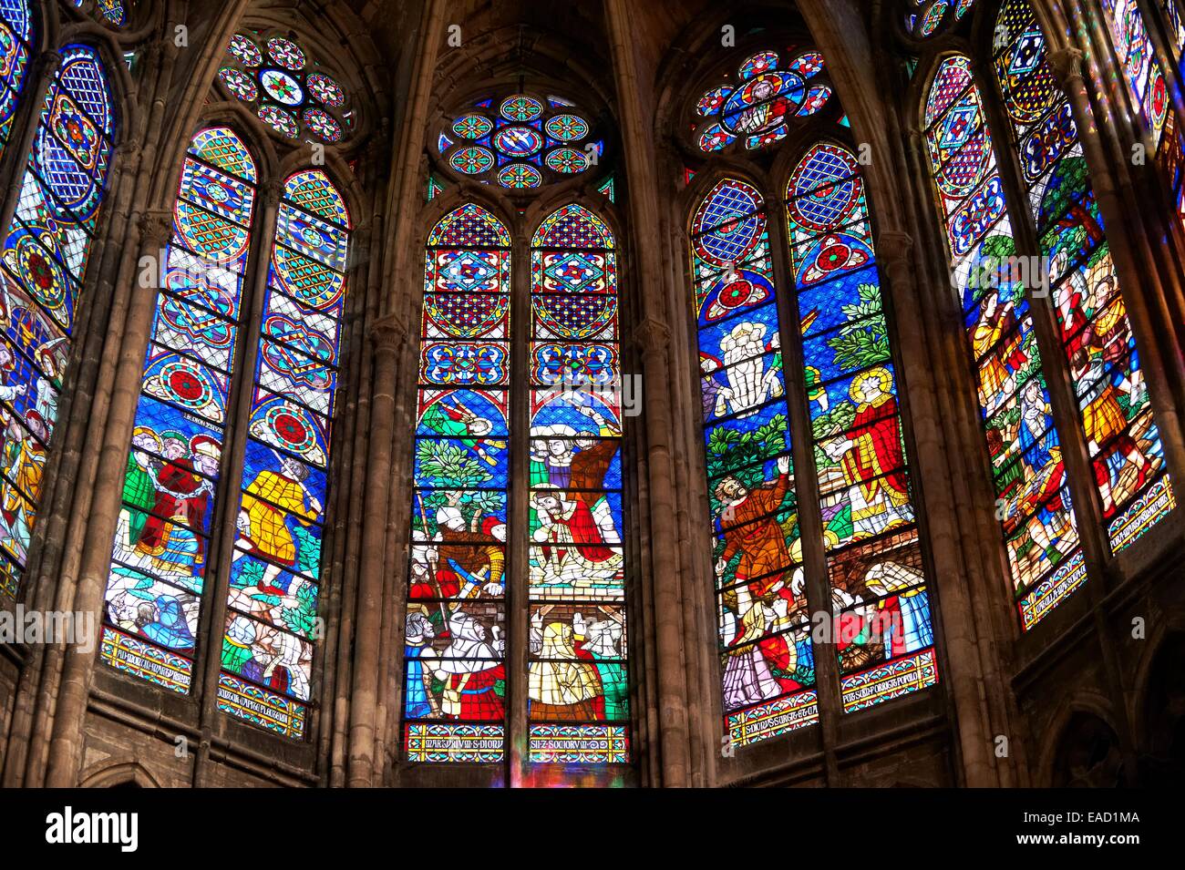 Medieval Gothic stained glass window showing scenes from the Martyrdom of Saint Denis, Cathedral Basilica of Saint Denis Stock Photo