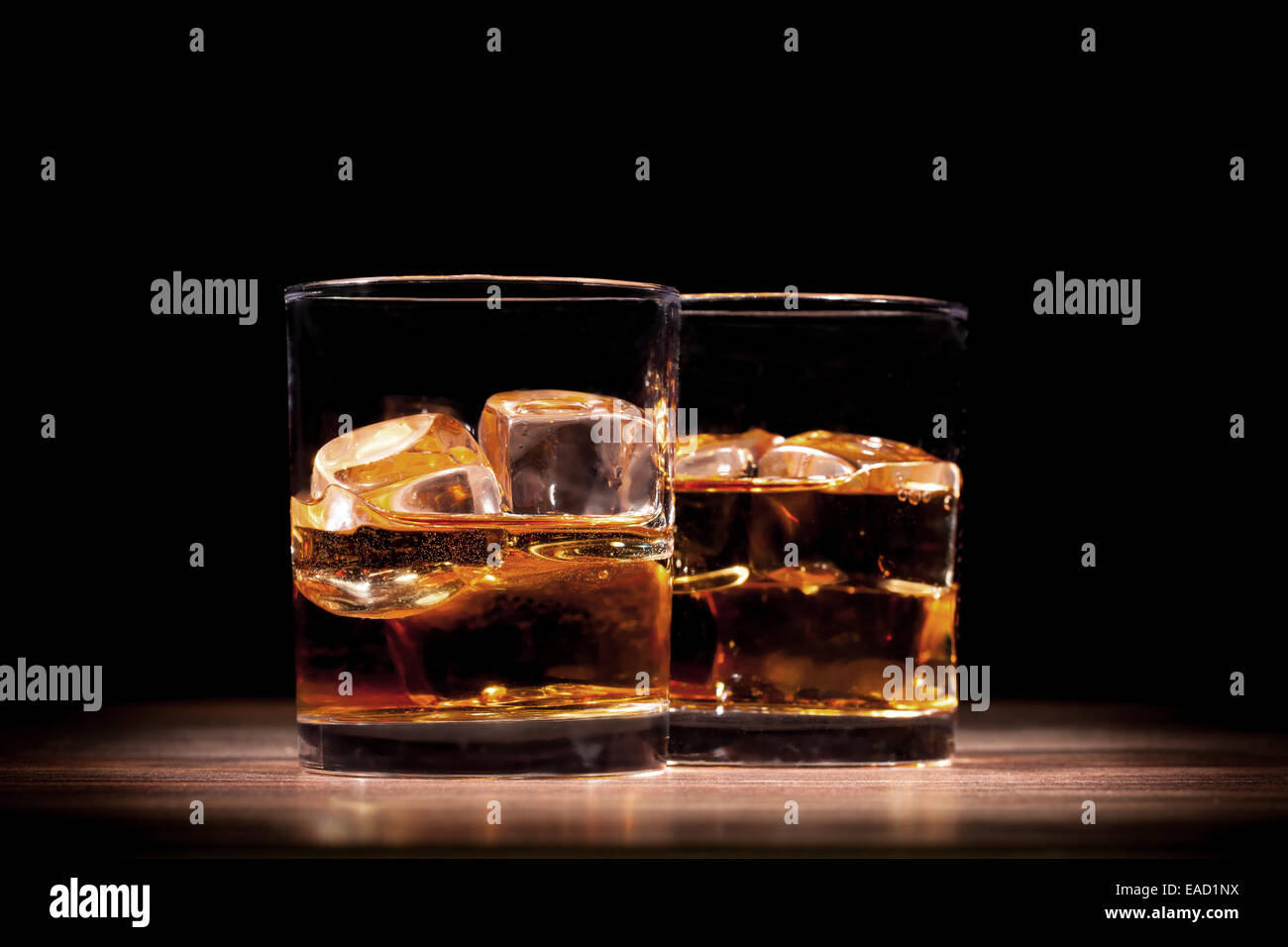 Couple of whiskey drinks on wooden table Stock Photo