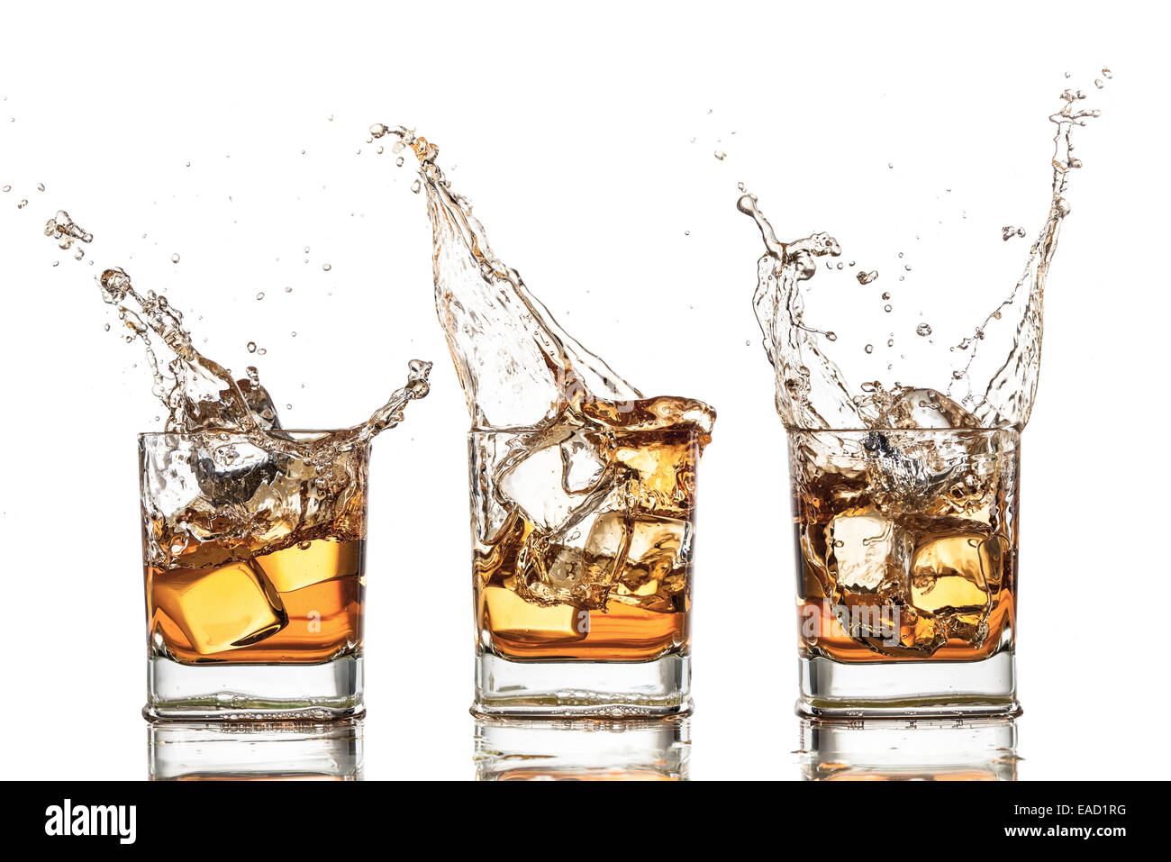 Isolated shots of whiskey with splash on white background Stock Photo