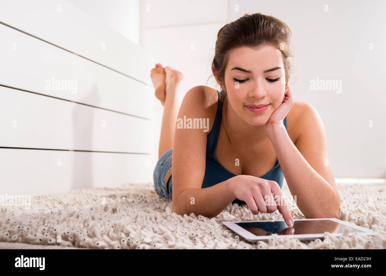 Woman lying floor hi-res stock photography and images - Alamy