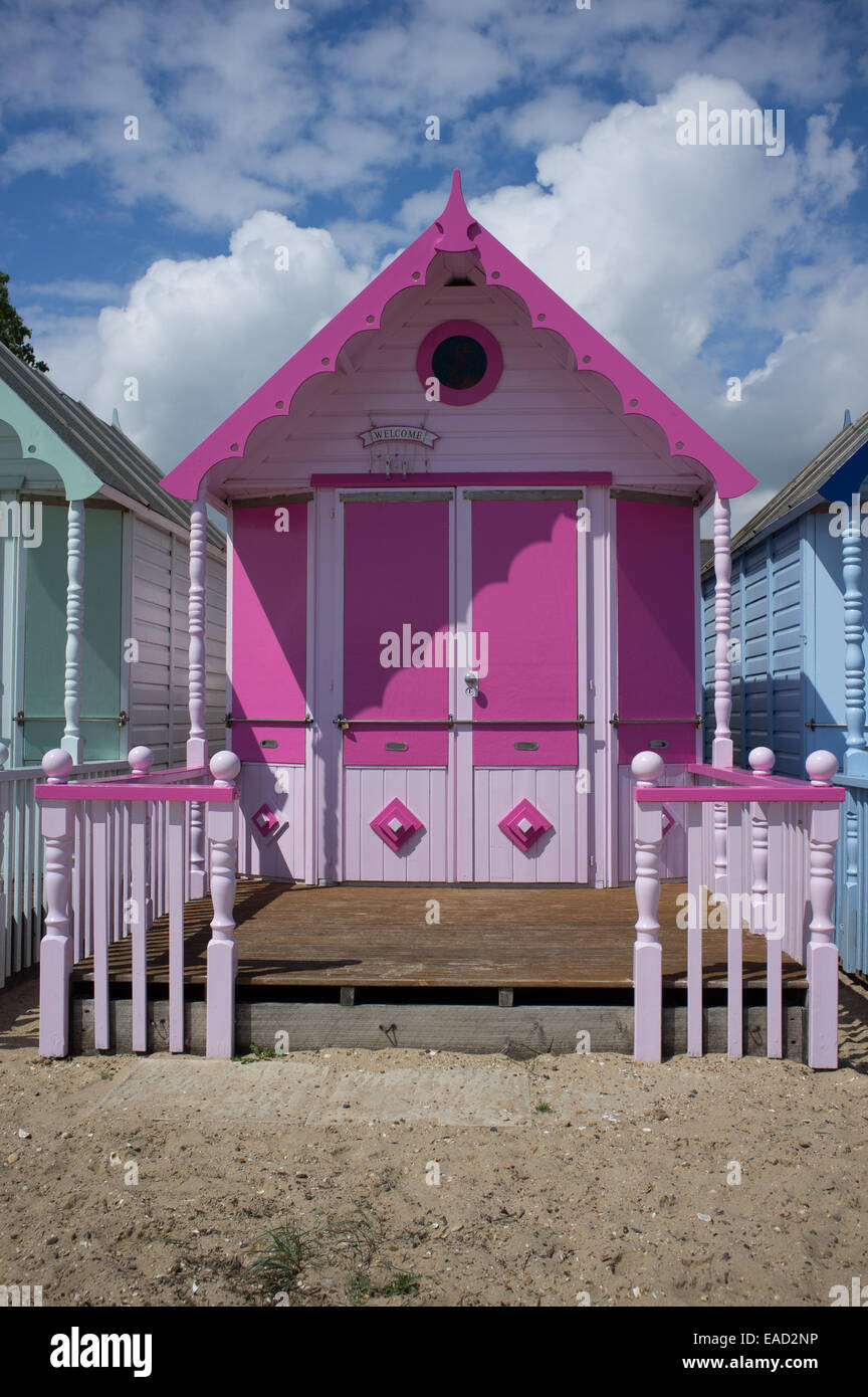 Colourful beach huts on the beach, Mersea Island, Essex Stock Photo