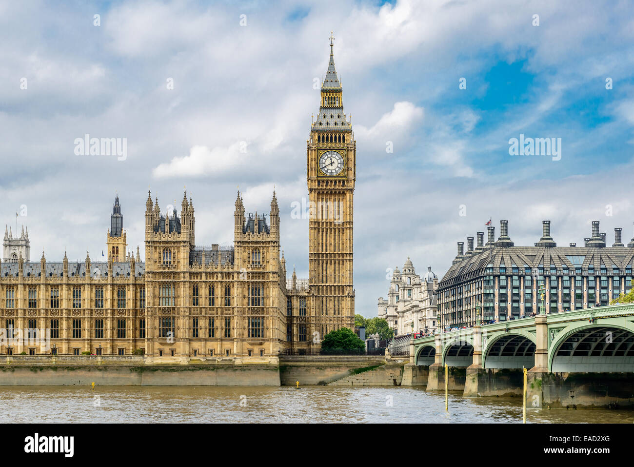 LONDON - AUGUST 27, 2014: Tourists cross the Westminster Bridge in front of the Big Ben and Houses of Parliament Stock Photo