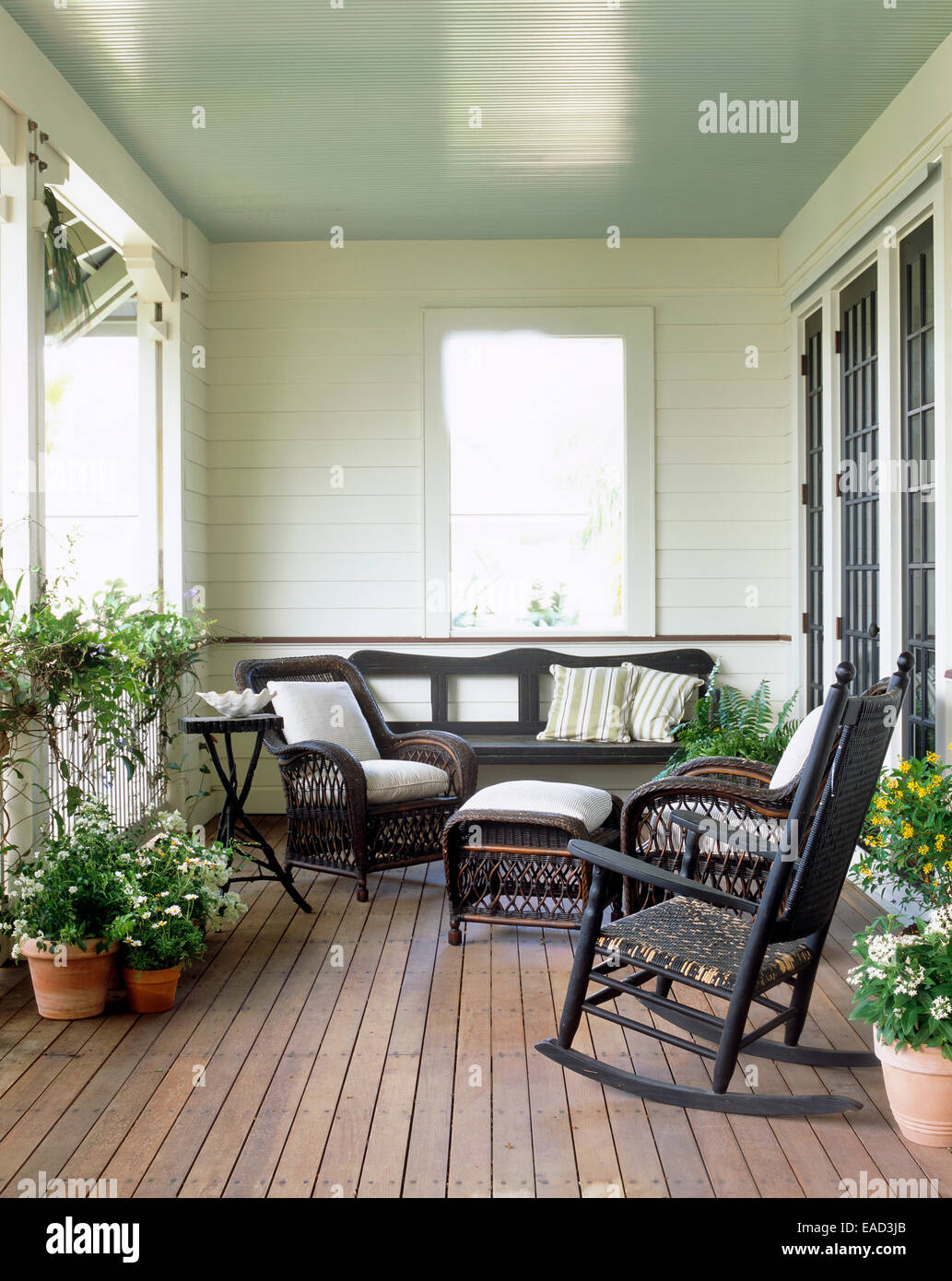 summer porch with flowers and wicker furniture Stock Photo Alamy
