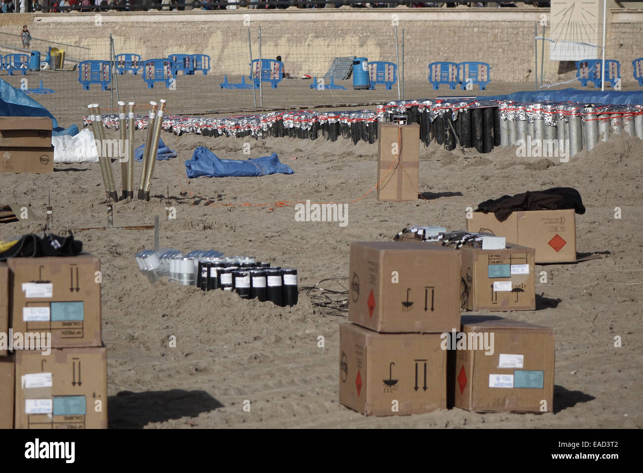 Benidorm, Spain. 12th November, 2014. The preparations for the final, gigantic fireworks spectacular of the Fiesta which happens tonight at 9pm are taking place in clear sunny weather on Poniente beach in Benidorm. Hundreds of explosive charges and mortar tubes which contain the larger fireworks are visible on the tourist beach which is fenced off for the popular event. Credit:  Mick Flynn/Alamy Live News Stock Photo