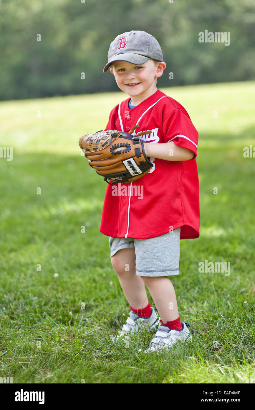 Little boy dressed ina baseball uniform with a baseball glove ready to play  Stock Photo - Alamy