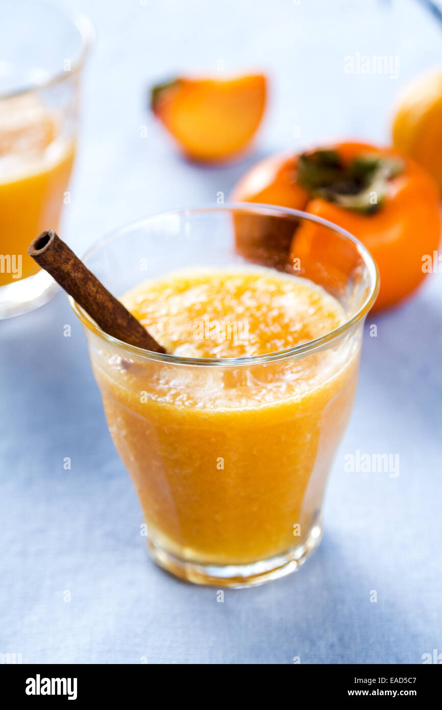 Persimmon with orange smoothie by fresh ingredients Stock Photo Alamy