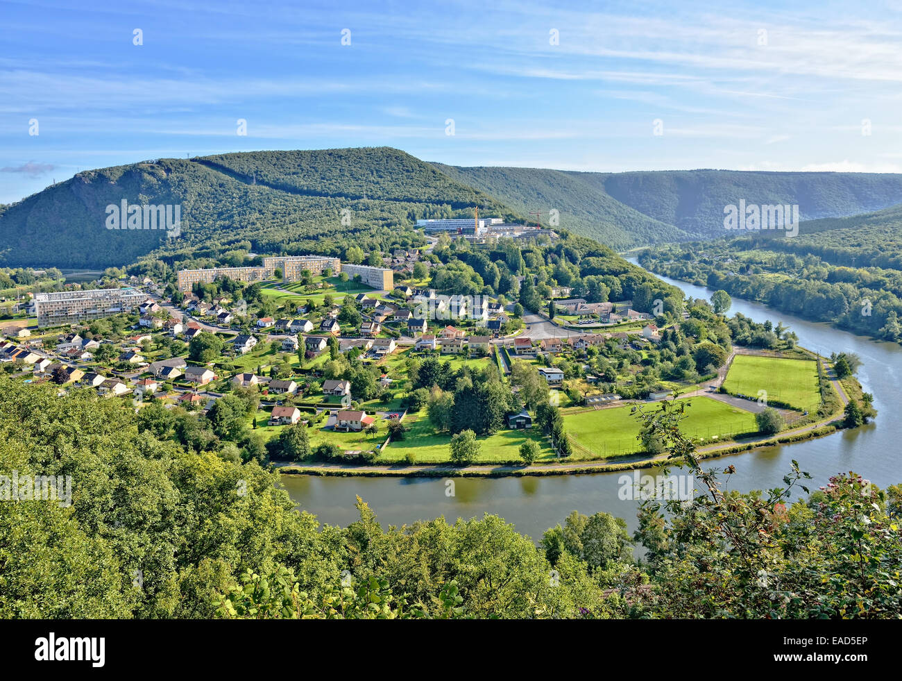 Panorama of Revin, a small town on river Meuse in Champagne-Ardenne, France under morning sun Stock Photo