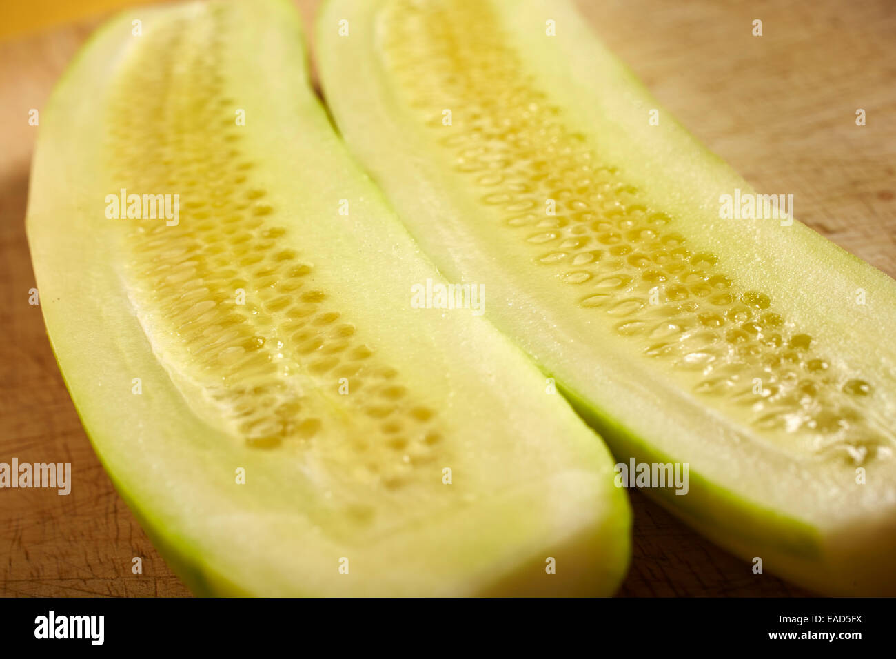 peeled, halved, fresh, ripe cucumber Stock Photo