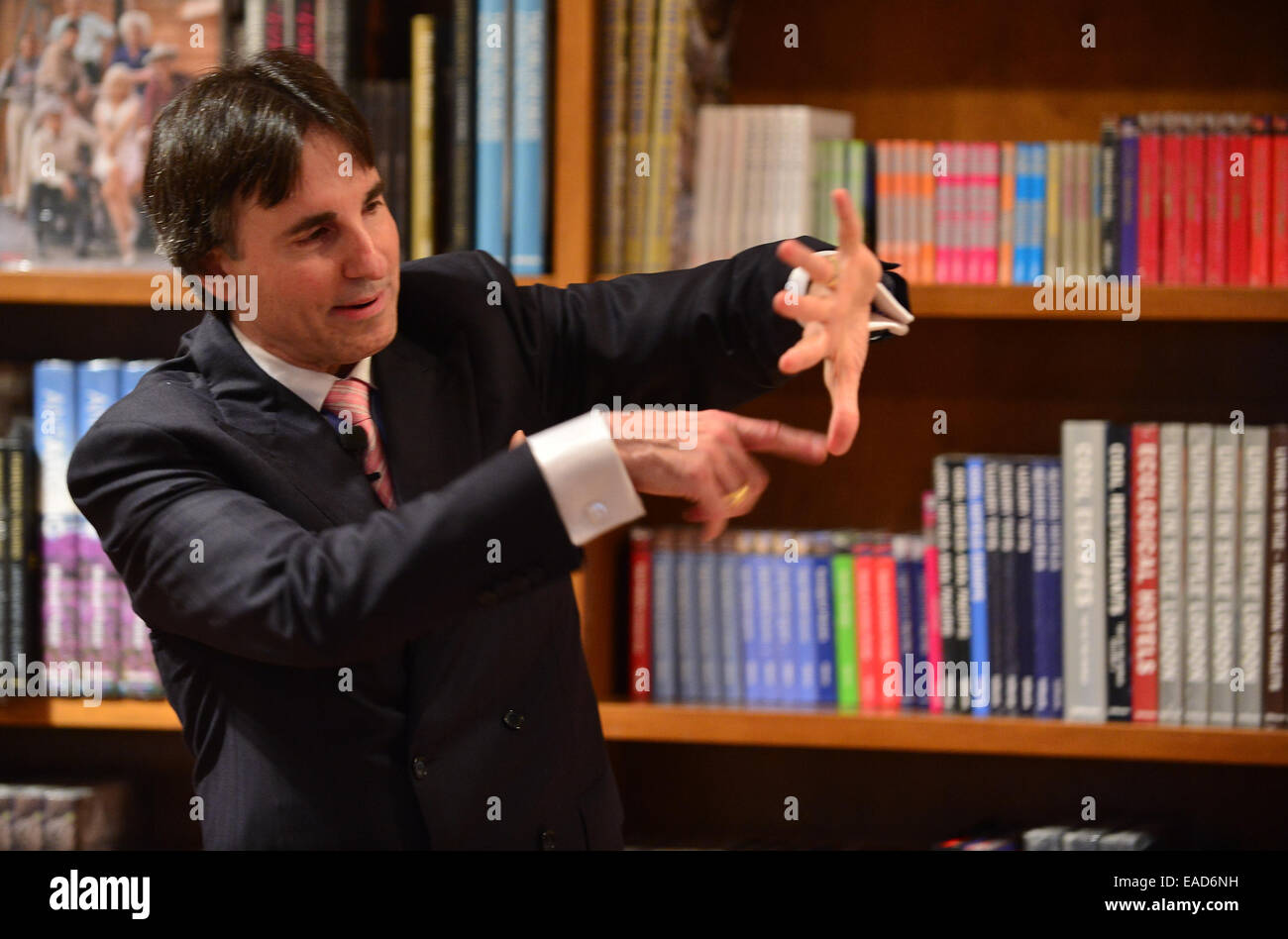 Author Dr. John Demartini signs copies of his book 'The