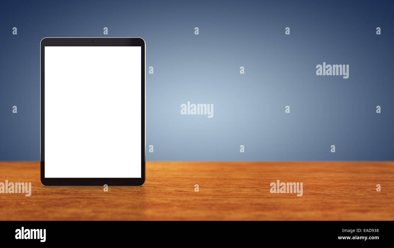 Large tablet with blank screen sitting on wooden counter top with blue background , copyspace , Mobile device copy space Stock Photo