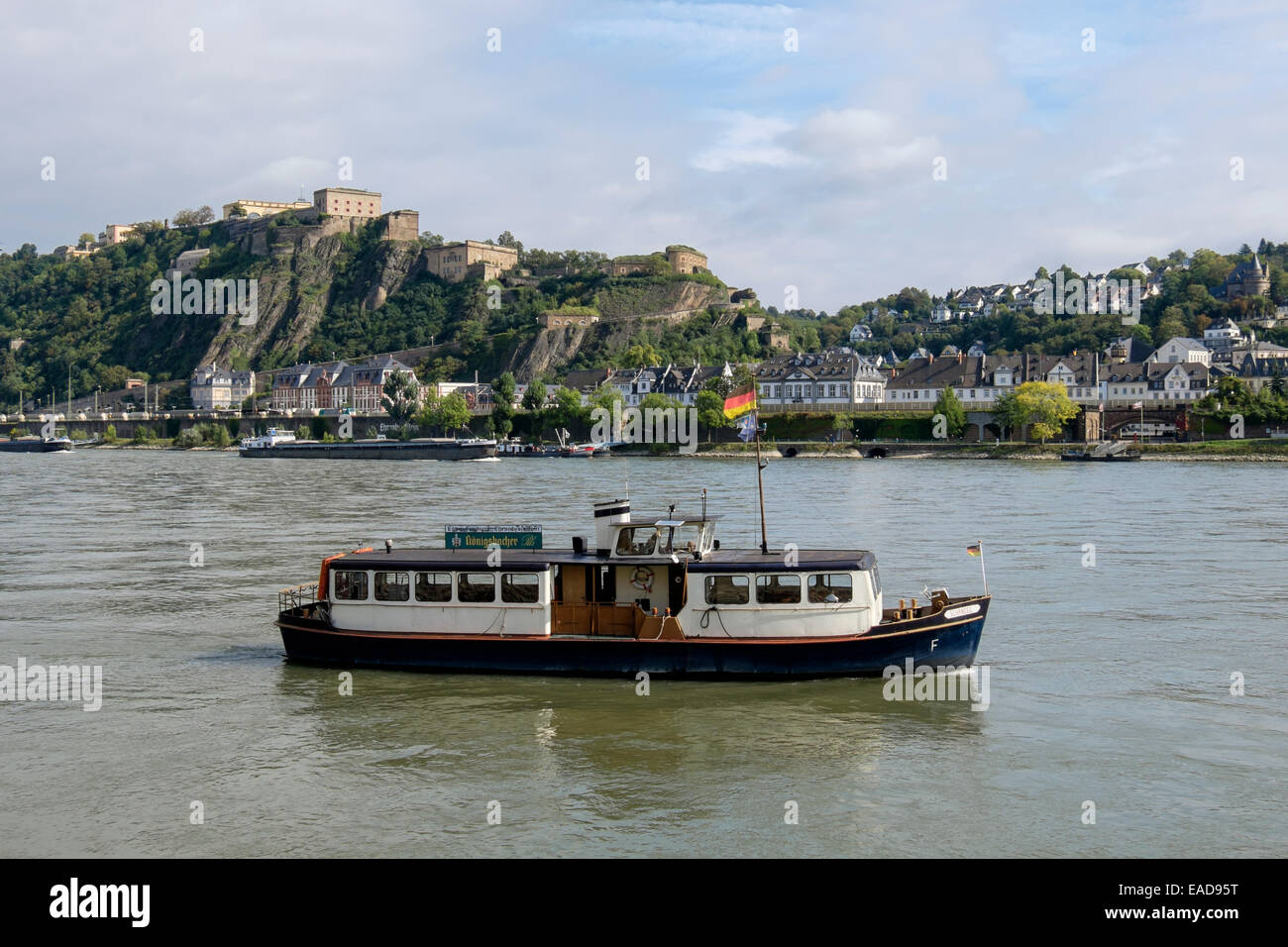 Ferry Schangel for foot passengers crossing River Rhine sailing past Ehrenbreitstein fort. Koblenz Rhineland-Palatinate Germany Stock Photo