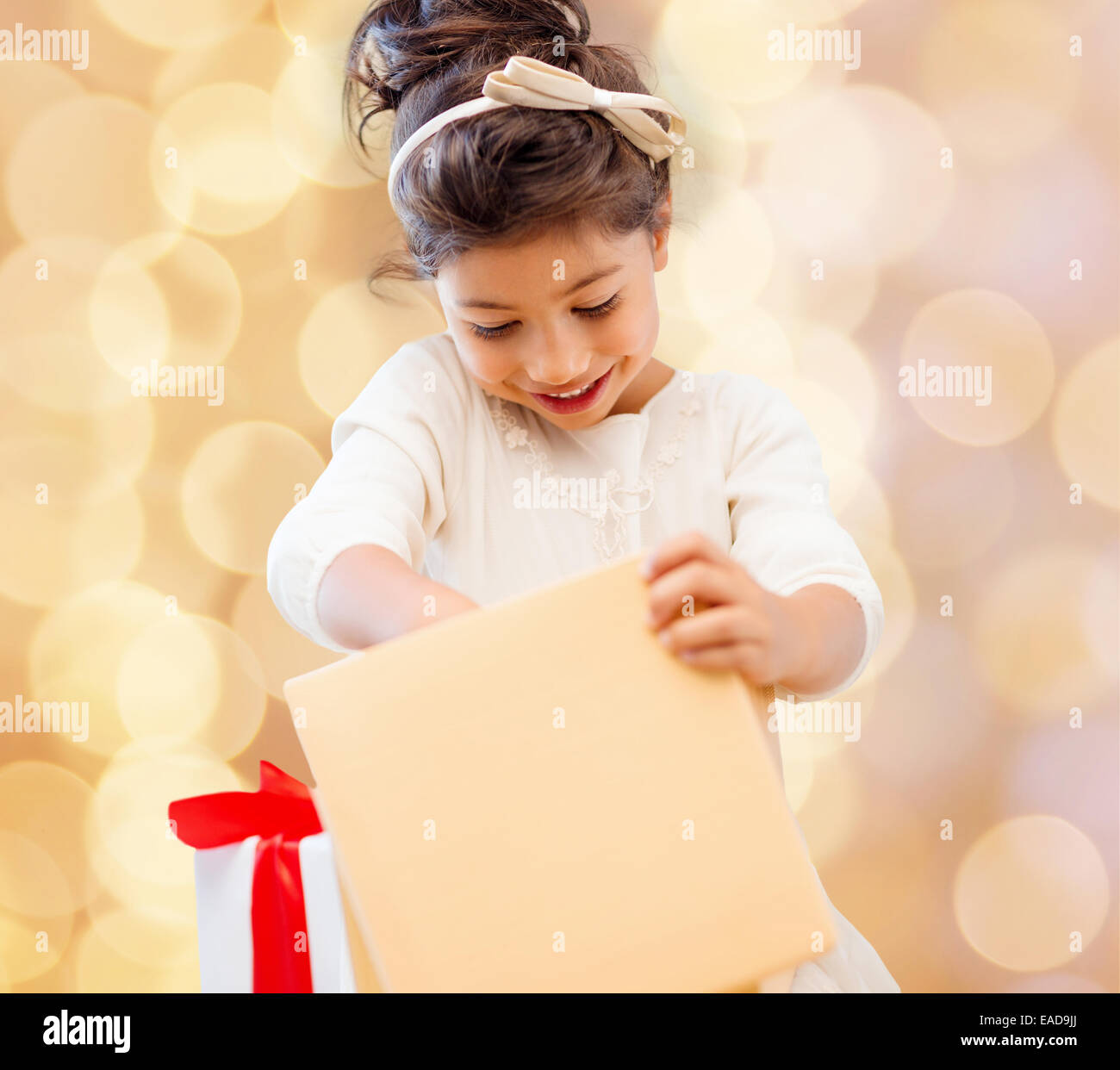 smiling little girl with gift box Stock Photo - Alamy