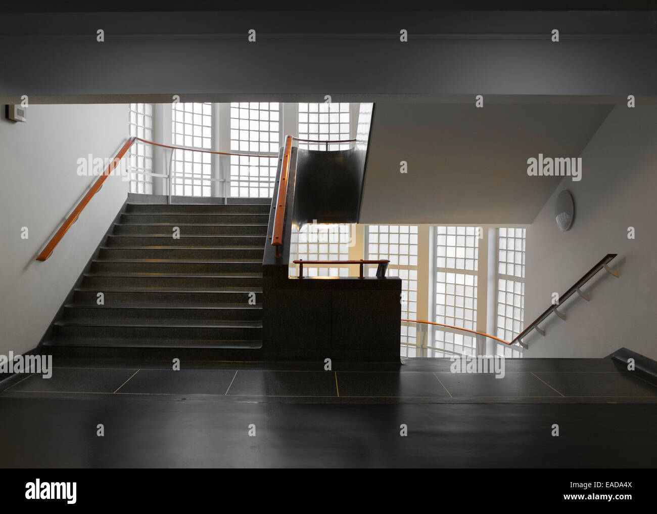 A window lit but plain, simple, unadorned staircase at the Science museum, London. Stock Photo