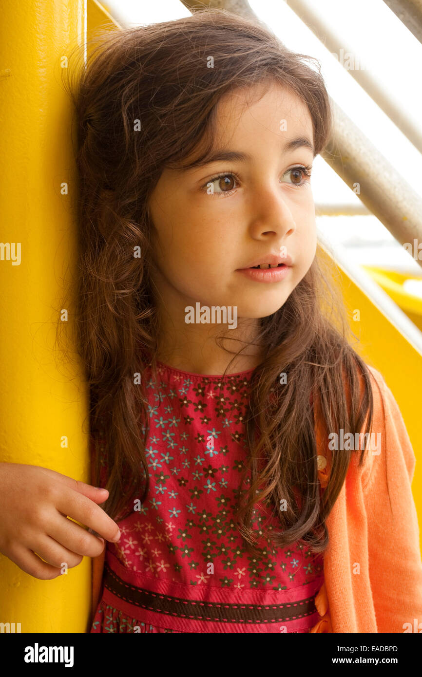 young girl in red dress on ferry Stock Photo