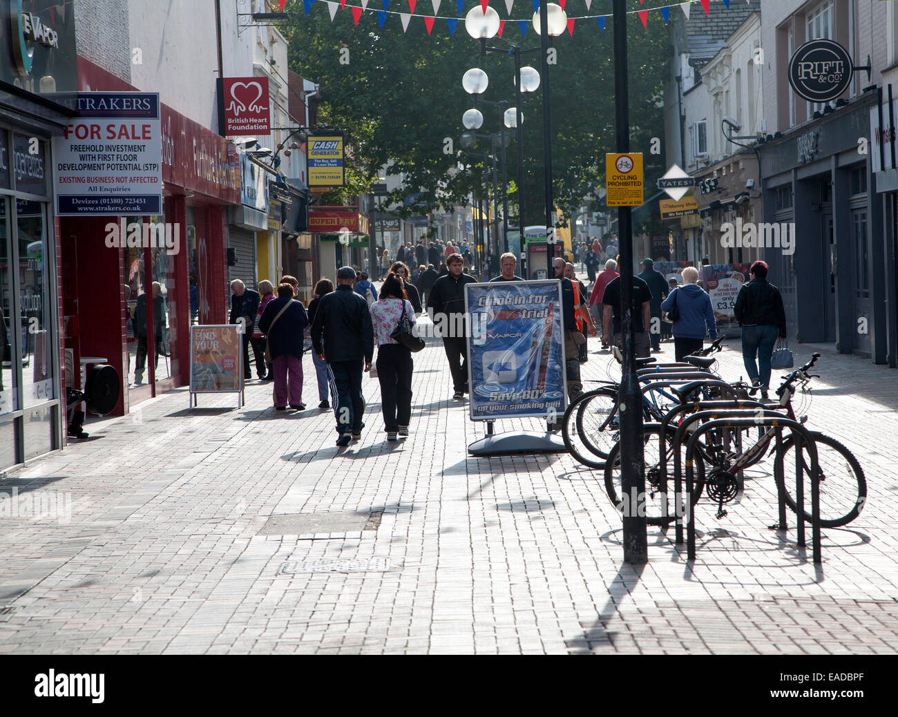 Busy pedestrianised shopping street in the town centre of Swindon, England, UK Stock Photo