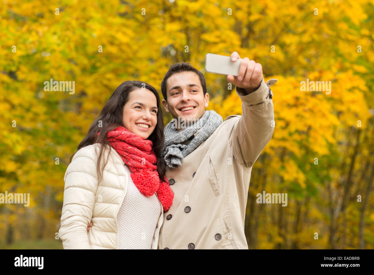 smiling couple hugging in autumn park Stock Photo - Alamy