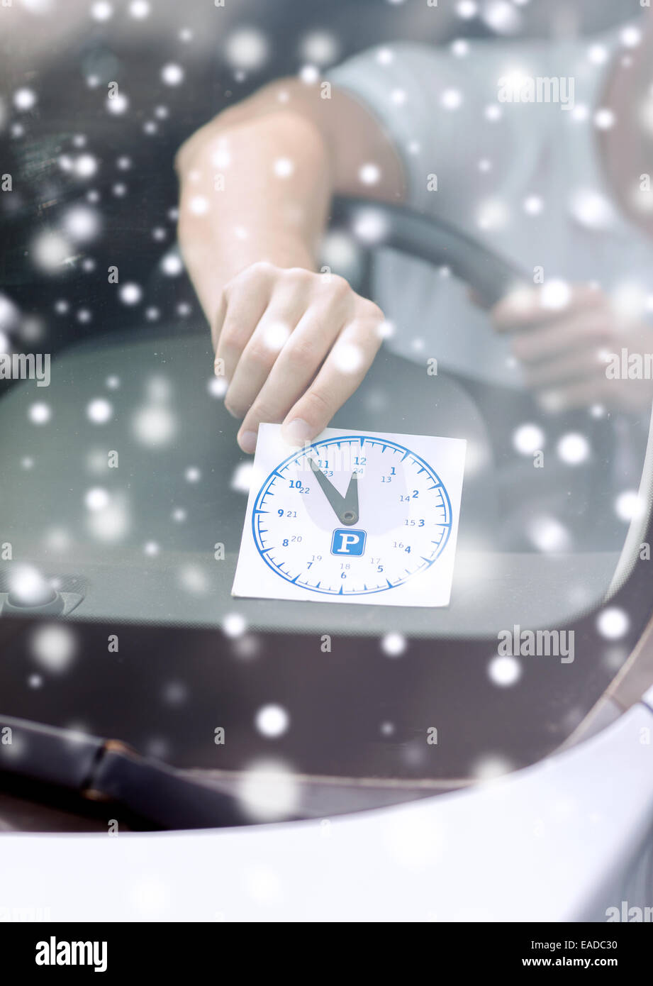 close up of man putting parking clock Stock Photo Alamy