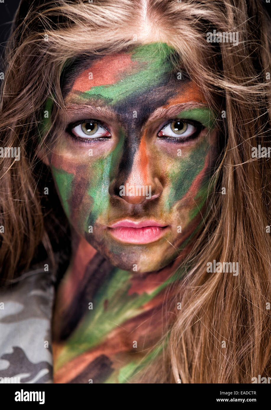 girl in protective camouflage with military makeup on her face Stock Photo  - Alamy