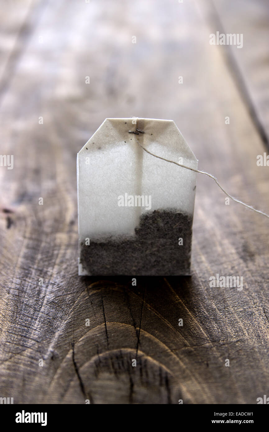 Tea Bag on old wooden table, close up Stock Photo