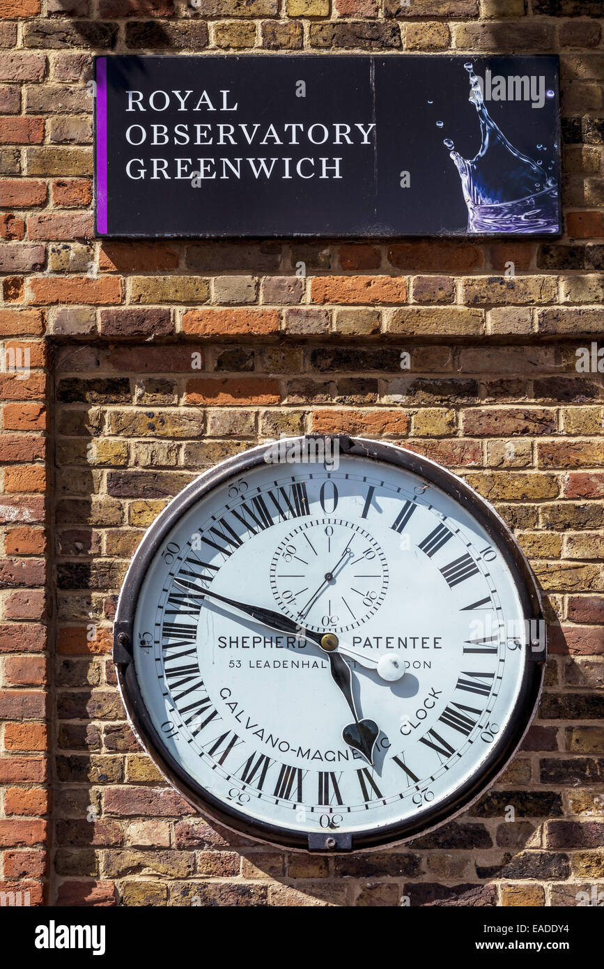 The Shepherd Gate Clock is the clock mounted on the wall outside the gate of the Royal Greenwich Observatory building in London. Stock Photo