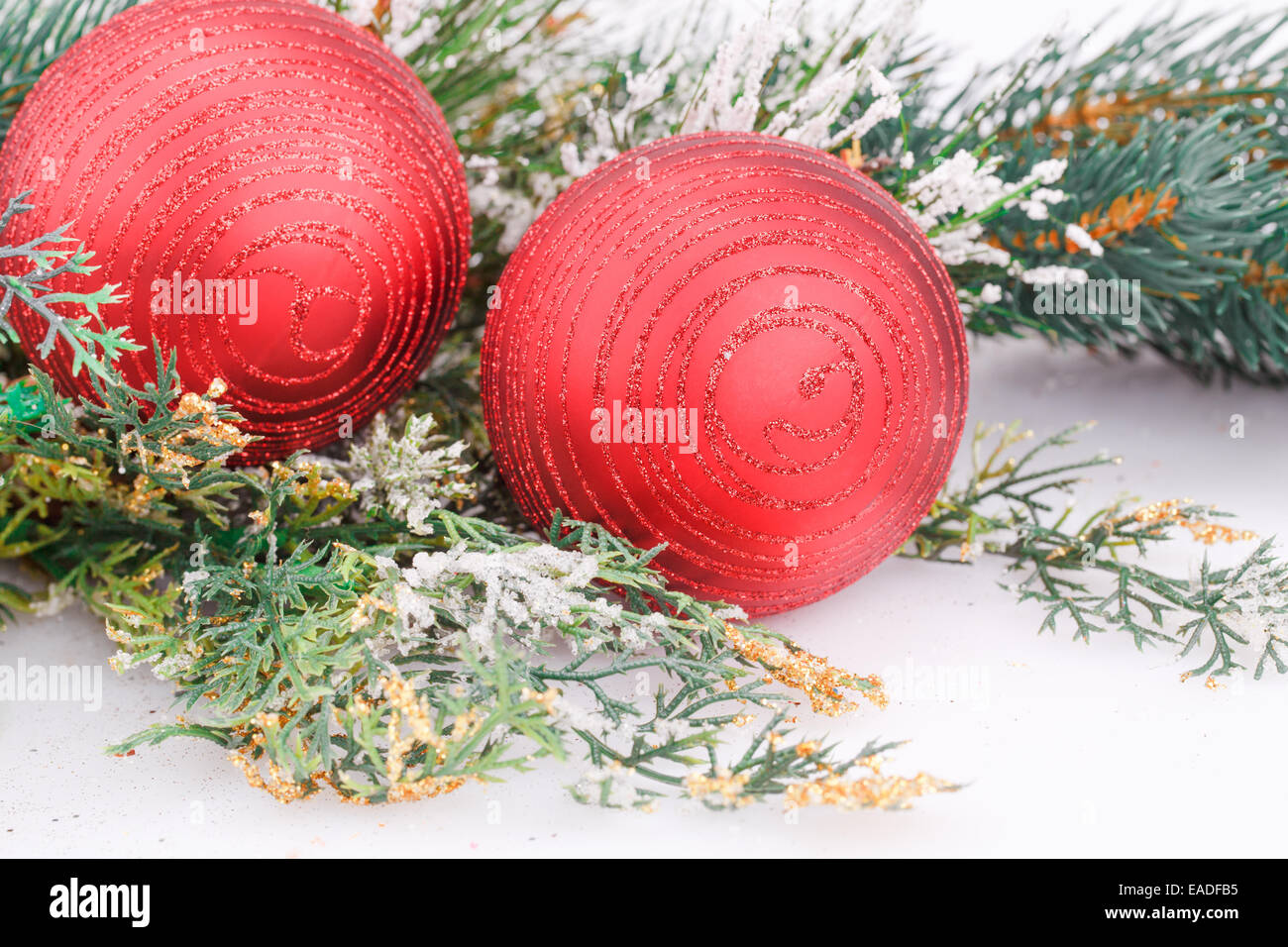 Christmas decoration with red balls and fir-tree branch Stock Photo - Alamy