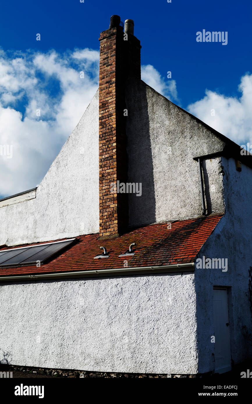 Wobbly chimney pots on an English cottage. Stock Photo