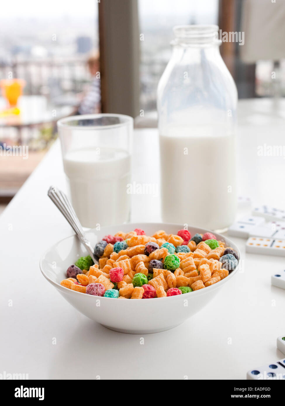 kid's breakfast cereal and milk on table at home in morning Stock Photo