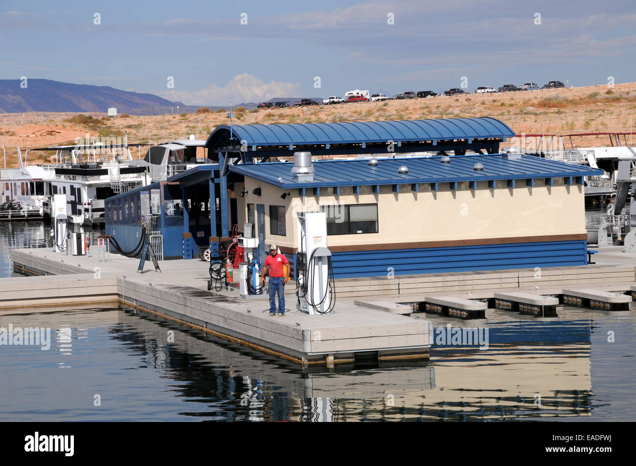 A gas attendant waits at the refueling dock at Bullfrog Marina, Lake