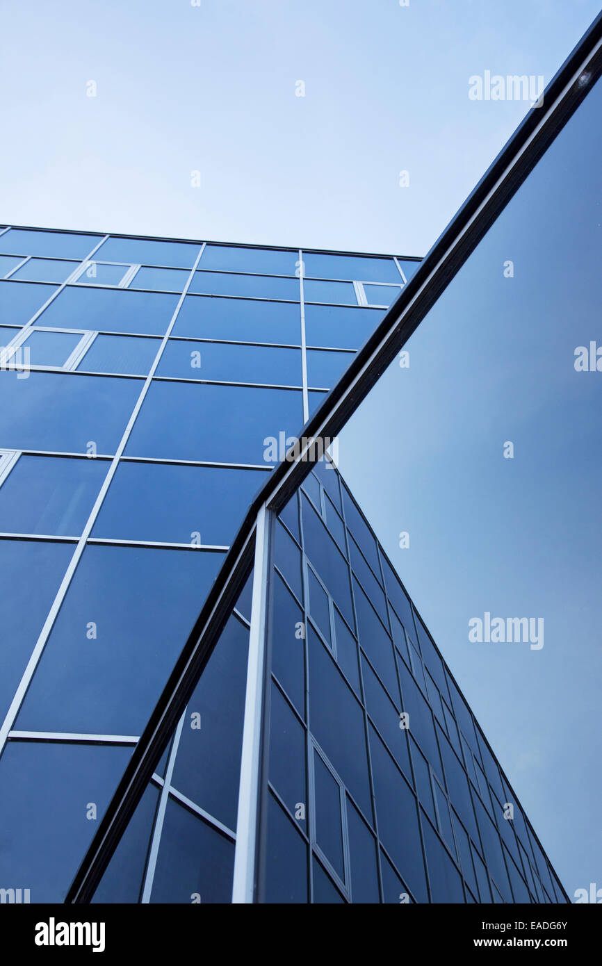 facade of office building and reflections of blue sky with clouds Stock ...