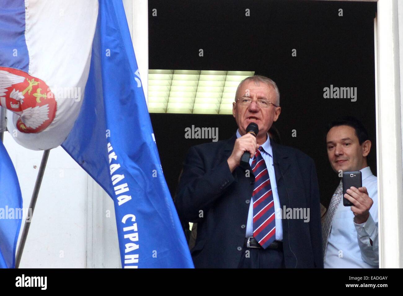 Belgrade. 12th Nov, 2014. Vojislav Seselj (L), former leader of the Serbian Radical Party, addresses his supporters at his party headquarters in Belgrade, Serbia, on Nov. 12. Vojislav Seselj who was indicted for war crimes was provisionally released due to health reasons on Wednesday. Credit:  Nemanja Cabric/Xinhua/Alamy Live News Stock Photo