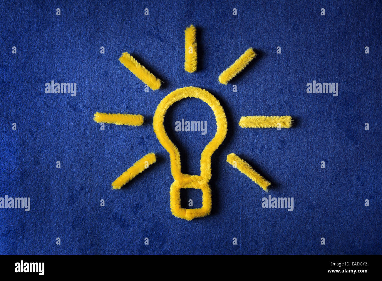 Inspiration concept yellow pipe cleaner light bulb metaphor for good idea Stock Photo