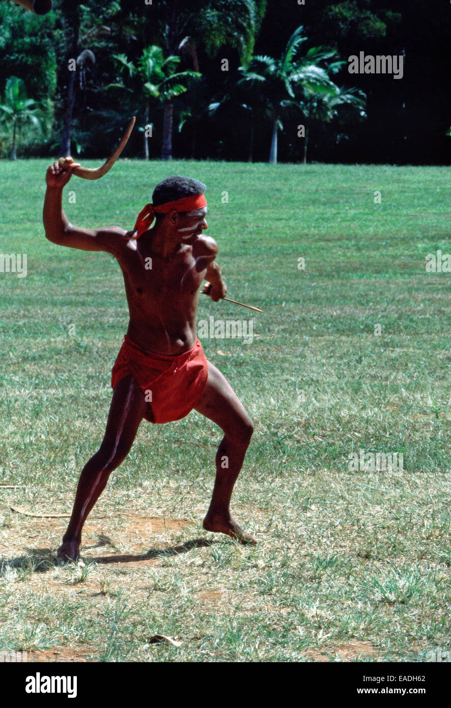 Aboriginal man throwing a boomarang,Australia Stock Photo