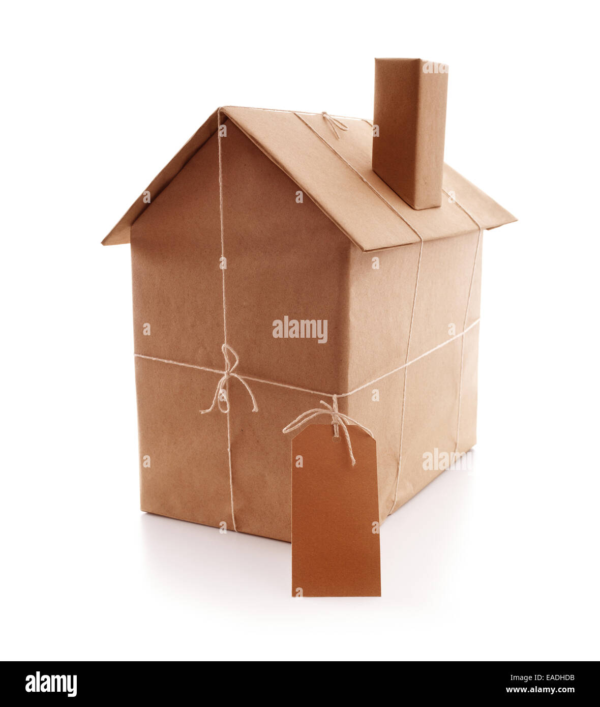 New house wrapped in brown paper Stock Photo