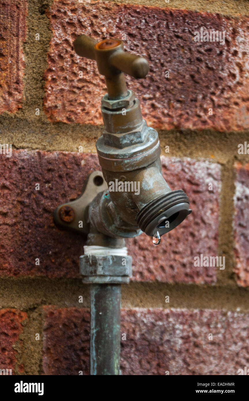 Water dripping from an outdoor tap Stock Photo