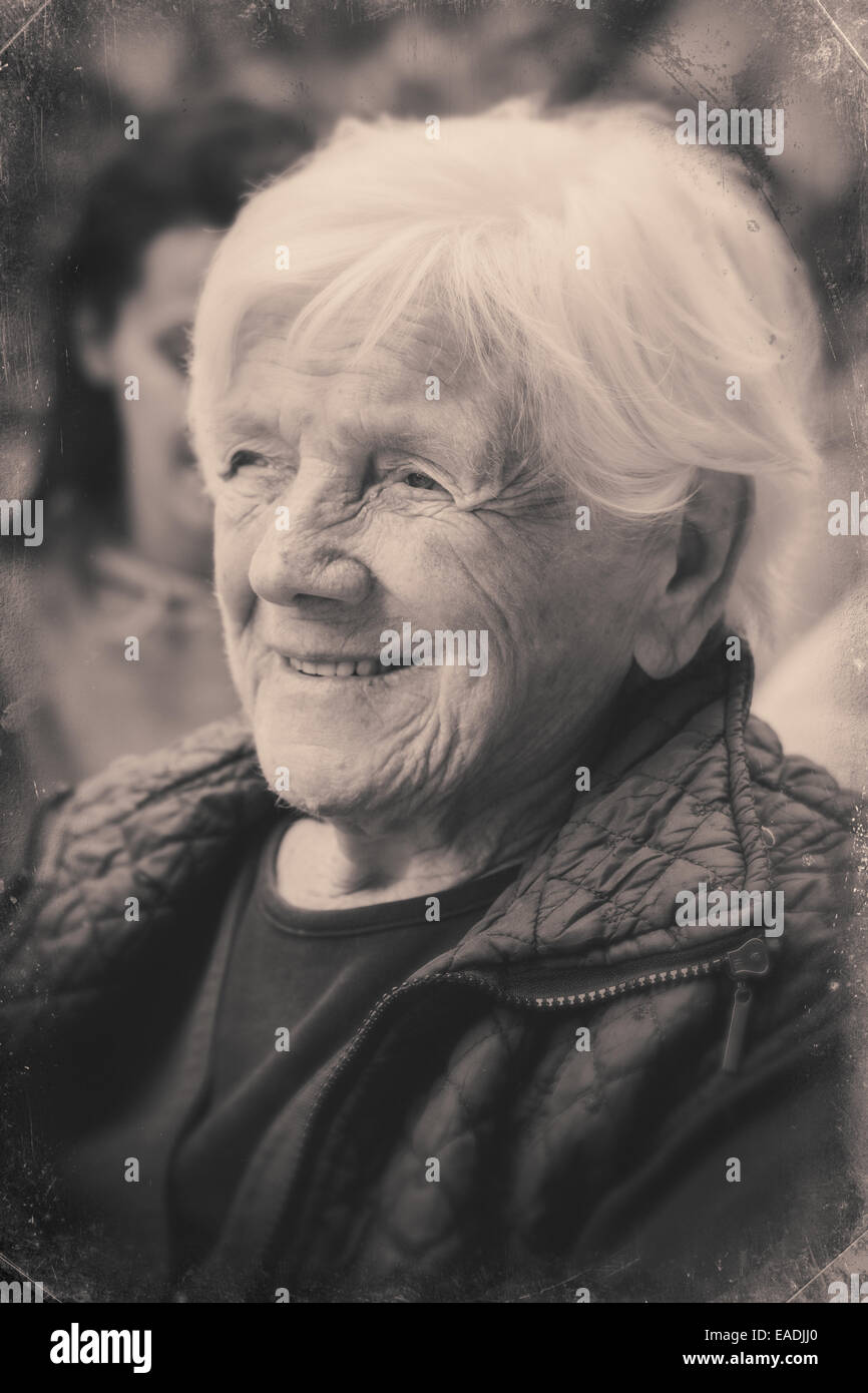 Portrait of a grandmother daydreaming, face only, closeup. styled black and white imagery Stock Photo