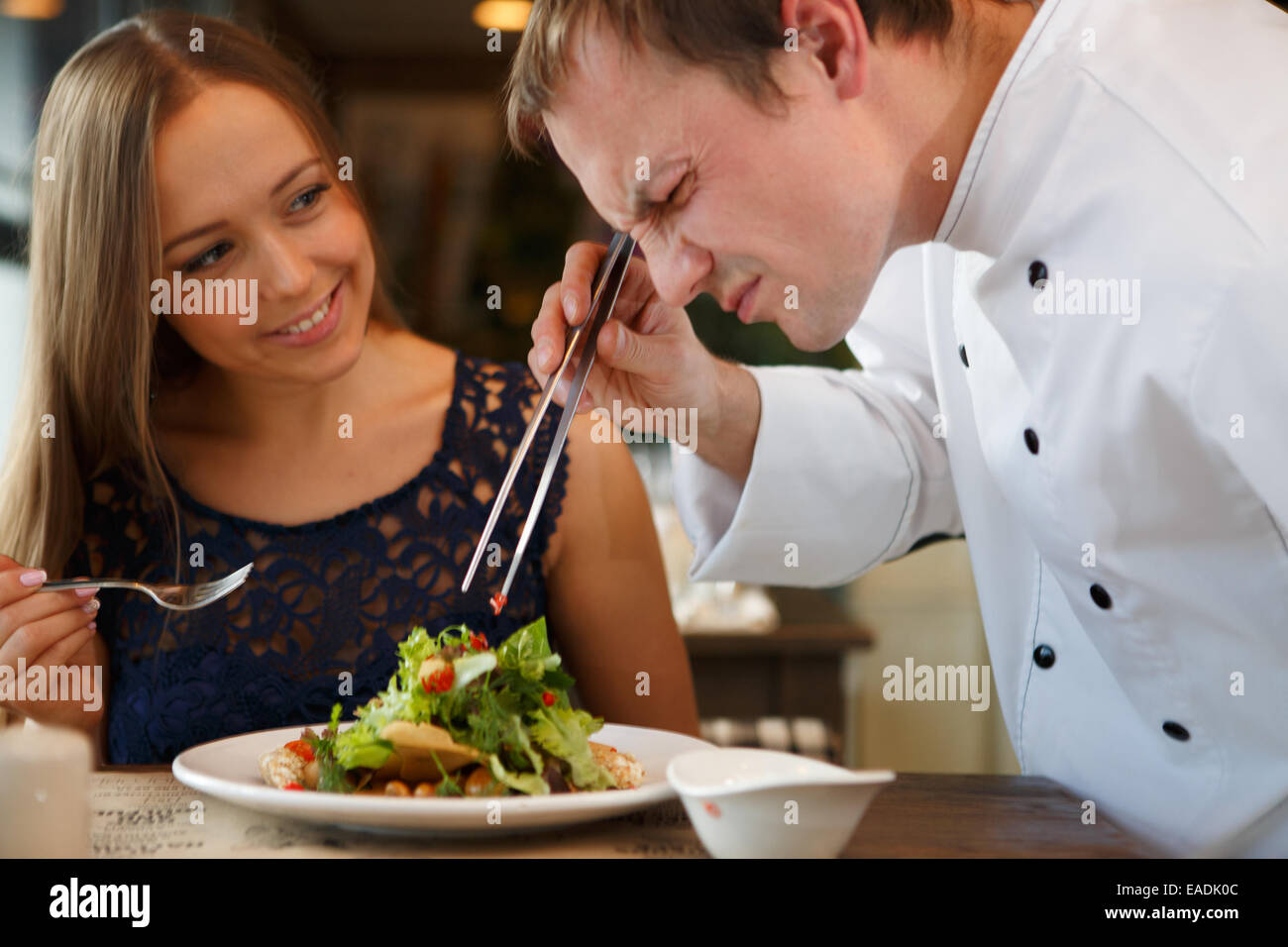 Chef decorating salad Stock Photo Alamy