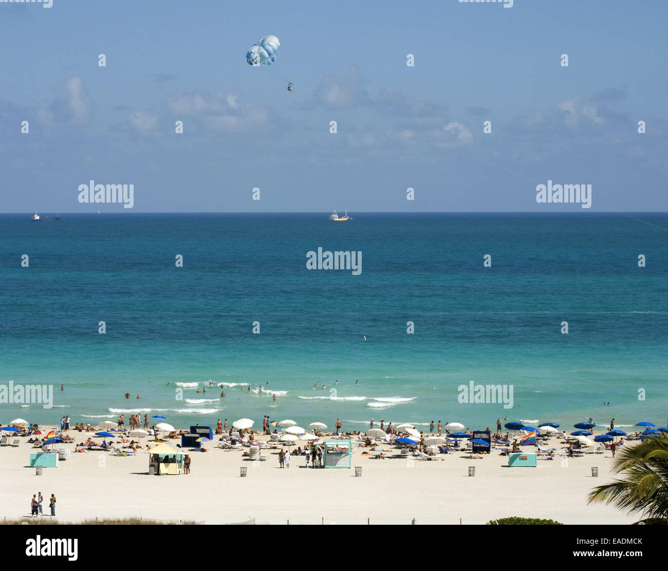 Miami Beach with bathers and parasailer Stock Photo