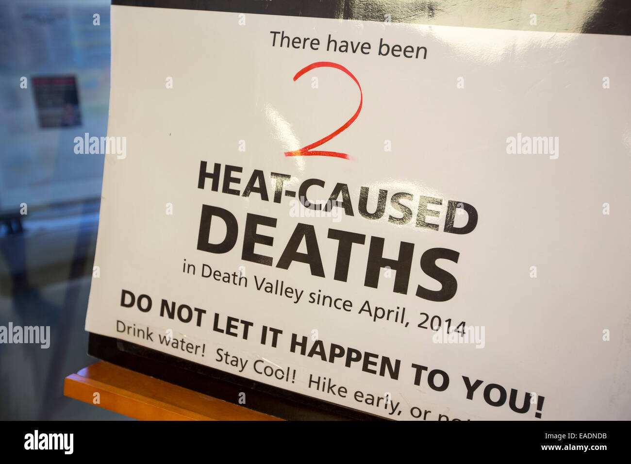 A warning about hear related deaths at the Furnace Creek Visitor Centre in Death Valley. Death Valley is the lowest, hottest, driest place in the USA, with an average annual rainfall of around 2 inches, some years it does not receive any rain at all. Stock Photo